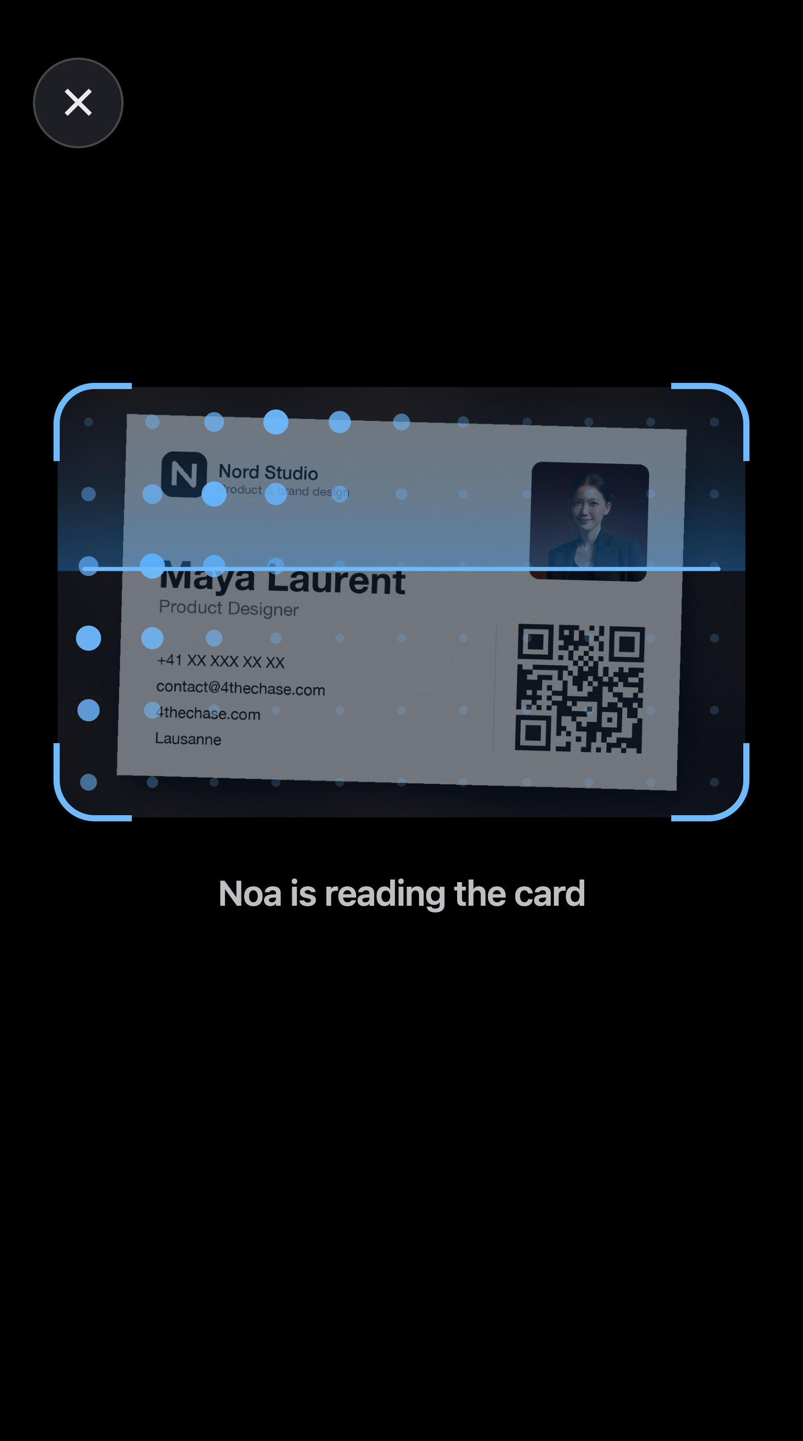 Reading the card: dots of light sweep across the card while Noa reads it